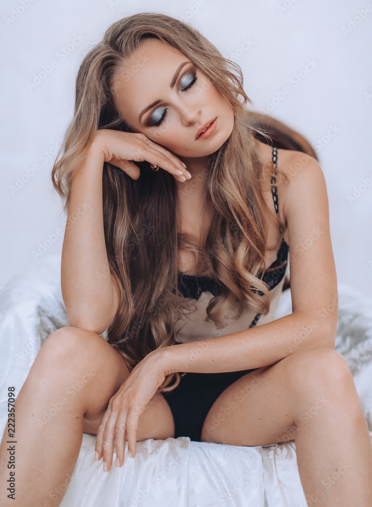 Naklejka premium Portrait of a beautiful young woman in underclothes