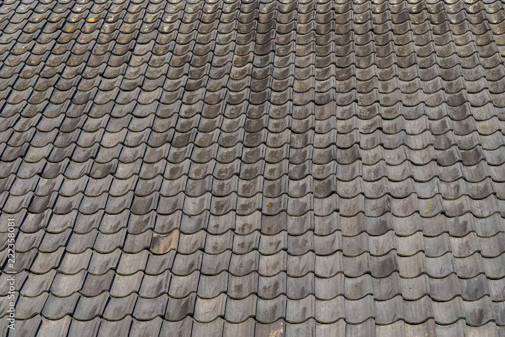 Grey roof tiles close up and full frame in rows Grey roof tiles close up and full frame in rows