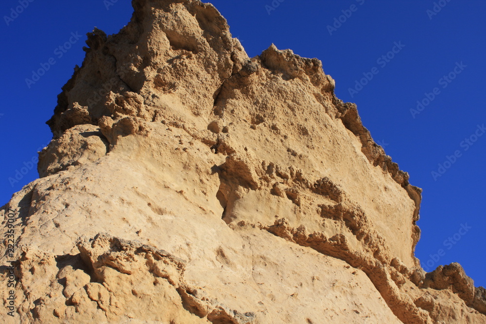 Fototapeta premium cliff edge with mountain on clouds blue sky