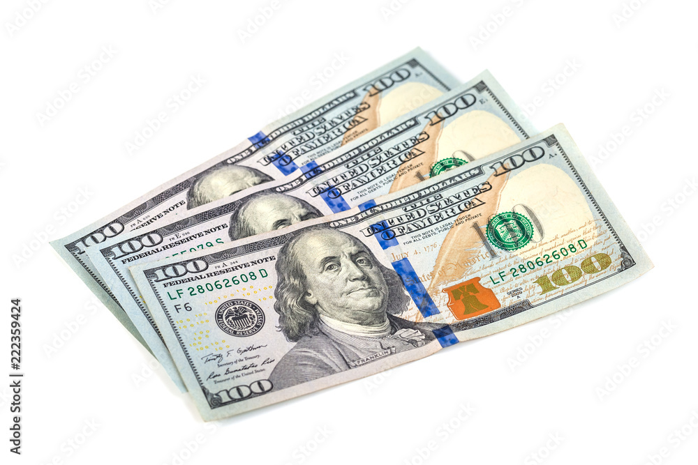 One hundred dollar bills, isolated on white One hundred dollar bills, isolated on white