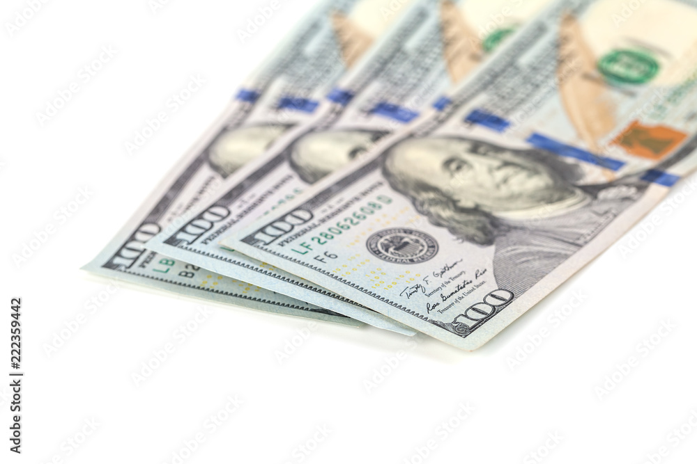 One hundred dollar bills, isolated on white One hundred dollar bills, isolated on white