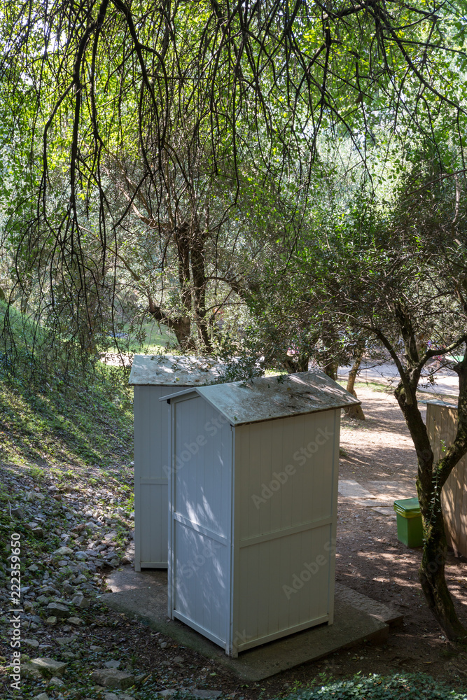 outdoor wooden toilet in the park
