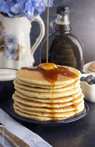 Stack of Freshly Made American Style Pancakes with Metling Butter