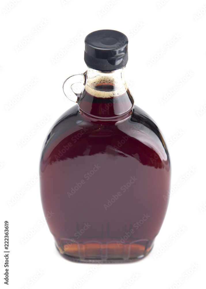 Bottle of Pure Maple Syrup on a White Background Bottle of Pure Maple Syrup on a White Background