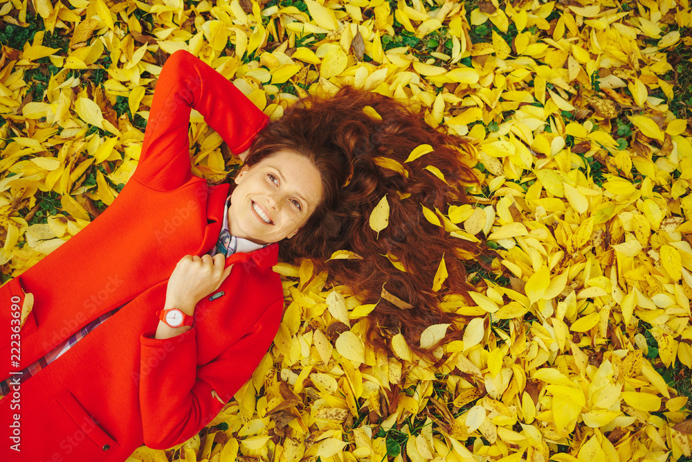 Young beautiful lady surrounded autumn leaves Young beautiful lady surrounded autumn leaves