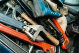 Closeup of an Adjustable Wrench, Hammer and Other Used Tools