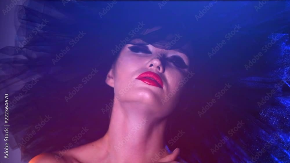 Fashion model woman in colorful bright neon lights posing, portrait of beautiful sexy girl with trendy make-up and colourful hairdo. Slow motion 4K UHD video 3840x2160 Fashion model woman in colorful bright neon lights posing, portrait of beautiful sexy girl with trendy make-up and colourful hairdo. Slow motion 4K UHD video 3840x2160