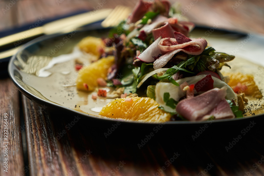 Vegetable salad with Smoked duck breast. Healthy fresh vegetable salad with smoked duck, Candied Walnuts, Spring Greens, Orange and Herbs