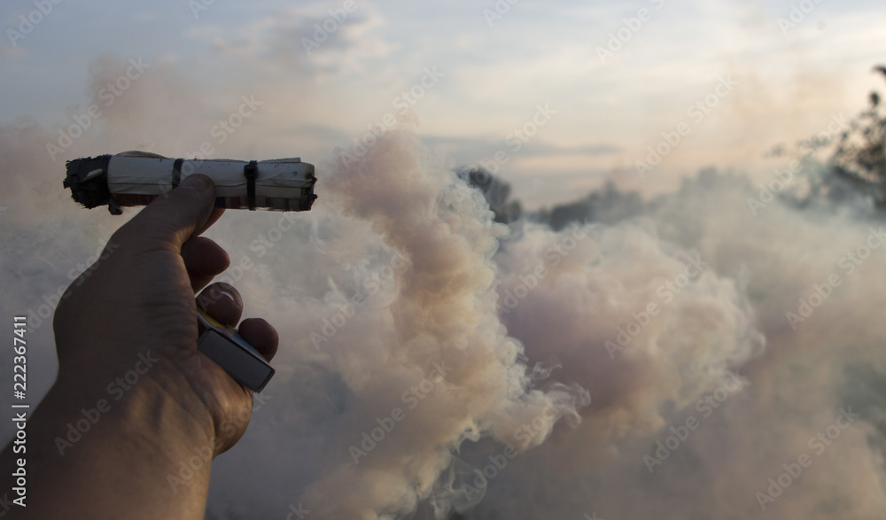 Smoke swirl, emits smoke in the man's hand Smoke swirl, emits smoke in the man's hand