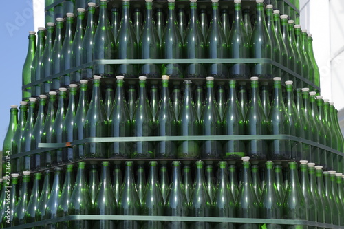 Christmas tree of bottles of champagne. Creative from bottles. Empty bottles of champagne.