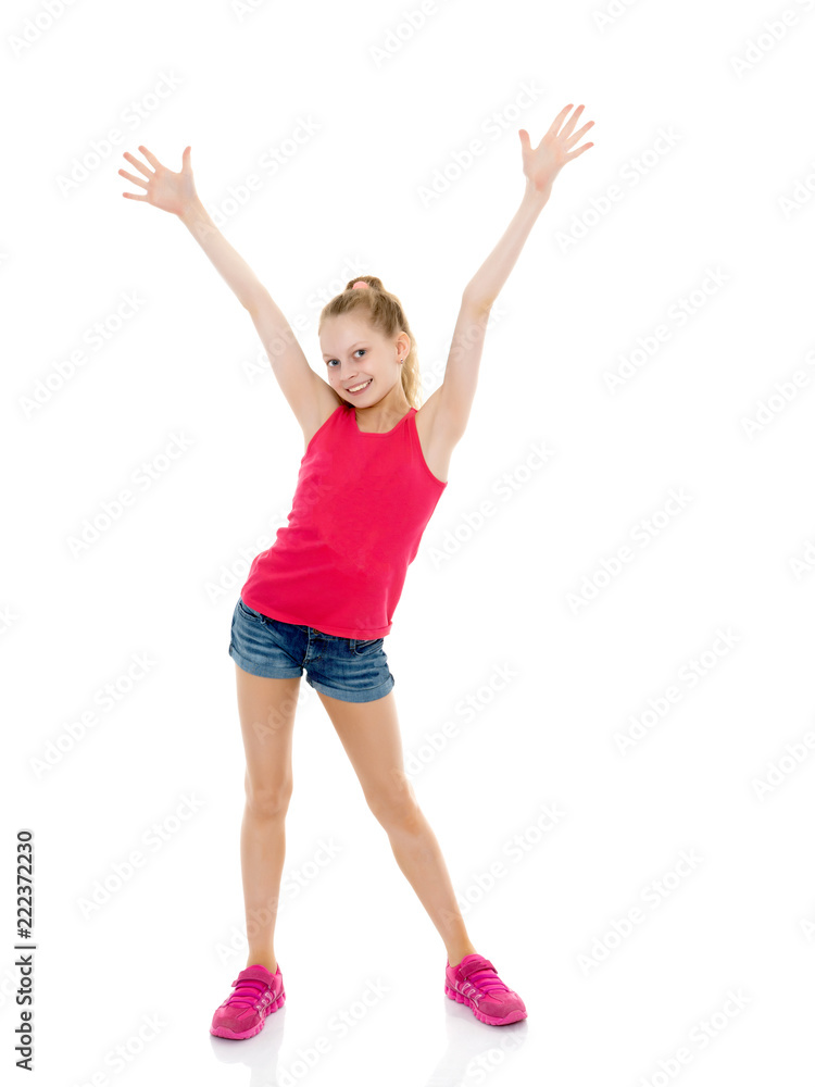 A cheerful little girl is dancing. A cheerful little girl is dancing.