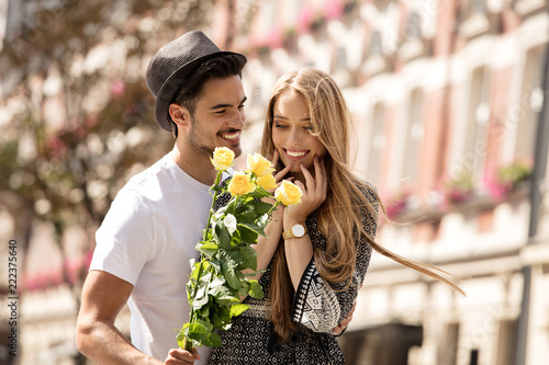 Beautiful couple with flowers dating.