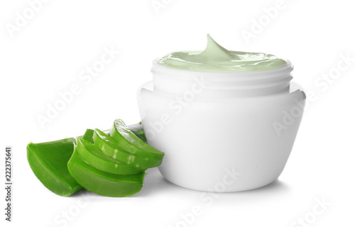 Jar with aloe vera balm and sliced leaves on white background