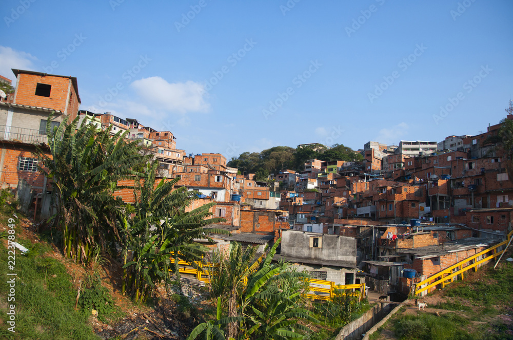 wide angle view of shanty town on a hill