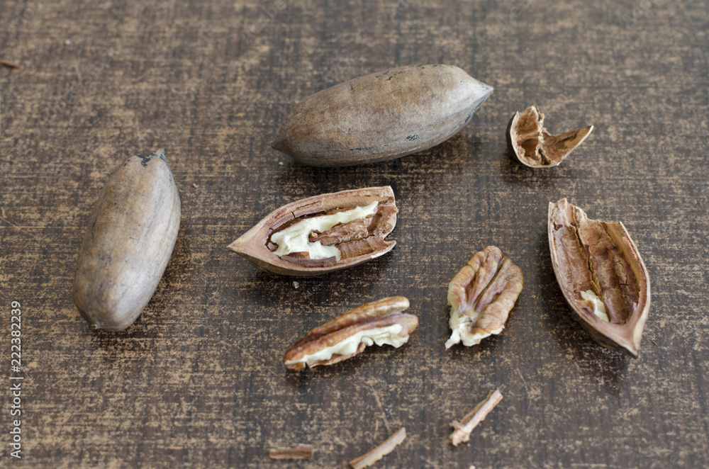 pecan nuts on brown background