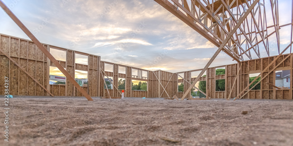 Wooden beams in sand area in building wide pano Wooden beams in sand area in building wide pano