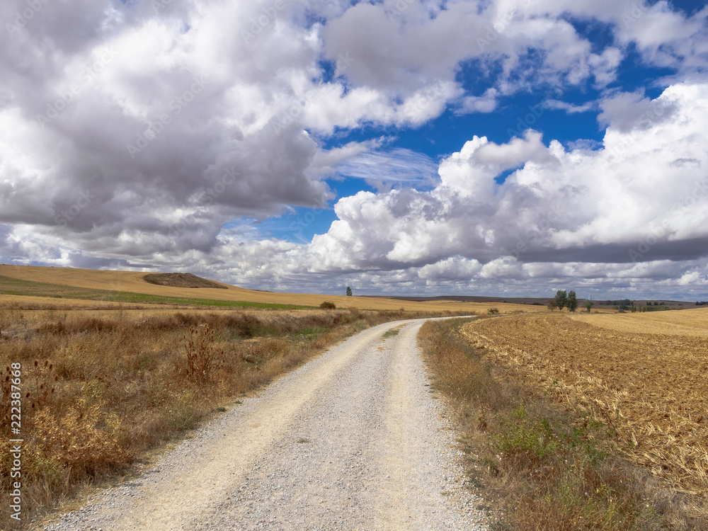 Heavy clouds over the old Roman road known as the Via Aquitana - Caldadilla de la Cueza, Castile and Leon, Spain