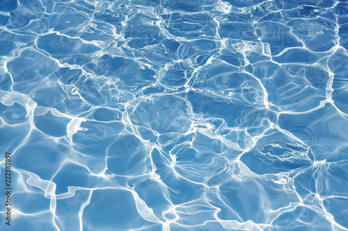 Texture of water in swimming pool for background