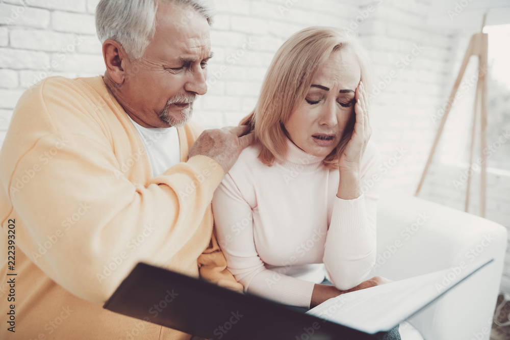 Old Man near Old Woman with Documents in Folder. Old Man near Old Woman with Documents in Folder.