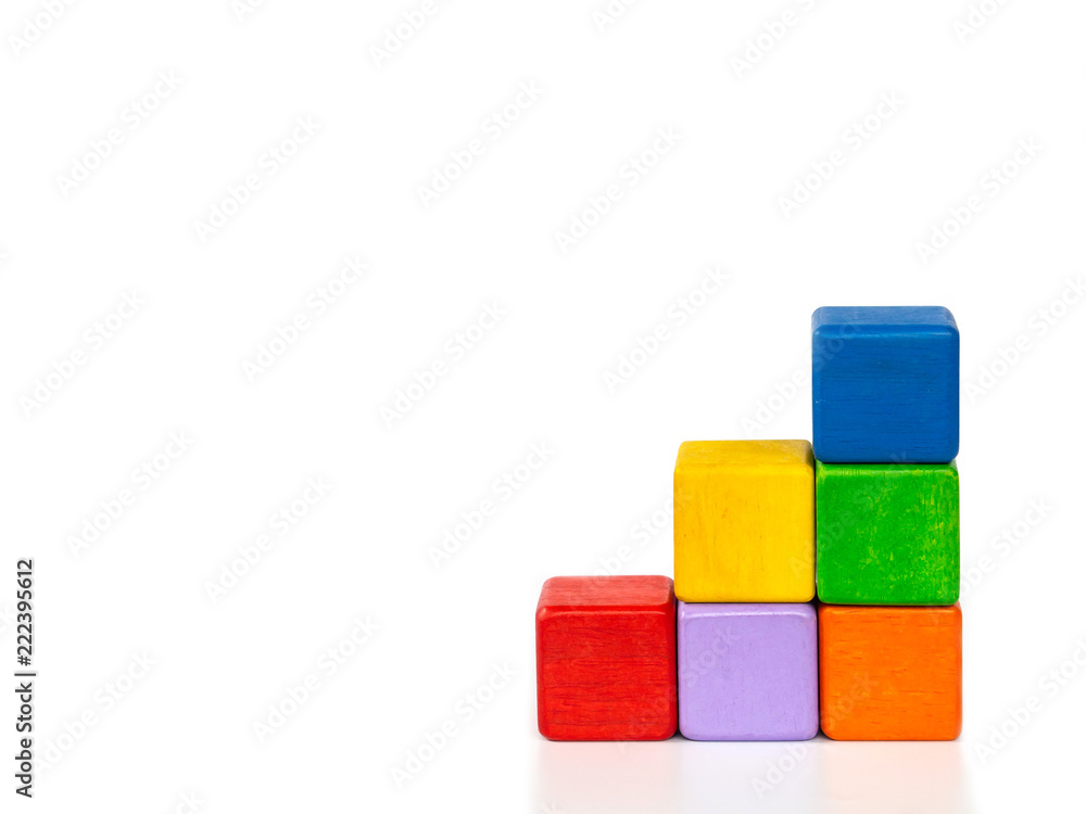 Colorful wooden blocks look like a staircase on white background with copyspace. Colorful wooden blocks look like a staircase on white background with copyspace.
