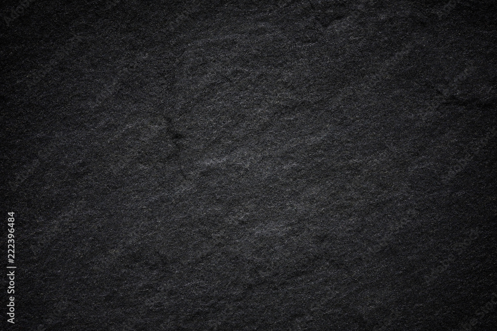 Dark grey black slate background or natural stone texture. Dark grey black slate background or natural stone texture.
