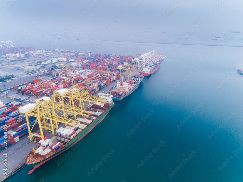 Aerial view container ship loading container from sea port warehouse for delivery containers shipment. Suitable use for transport or import export to global logistics concept.