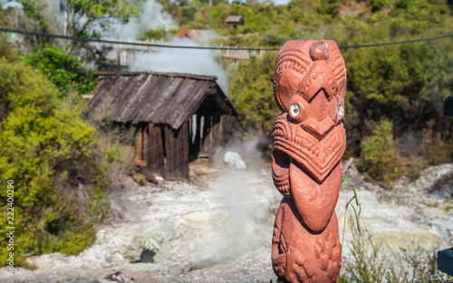 The Maori art carving decoration at natural hot springs in Whakarewarewa the living Maori village in geothermal area of Rotorua, New Zealand. photo