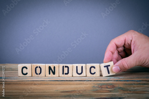 conduct, wooden letters on the office desk, informative and communication background