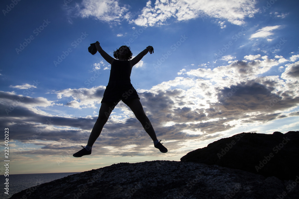 custom made wallpaper toronto digitalWoman jumping on cliffs in sunset