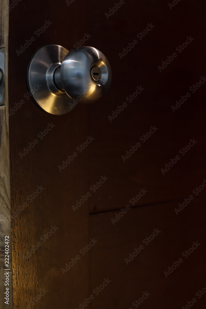 door knob on the wooden door background. House furniture, home decoration architecture design concept