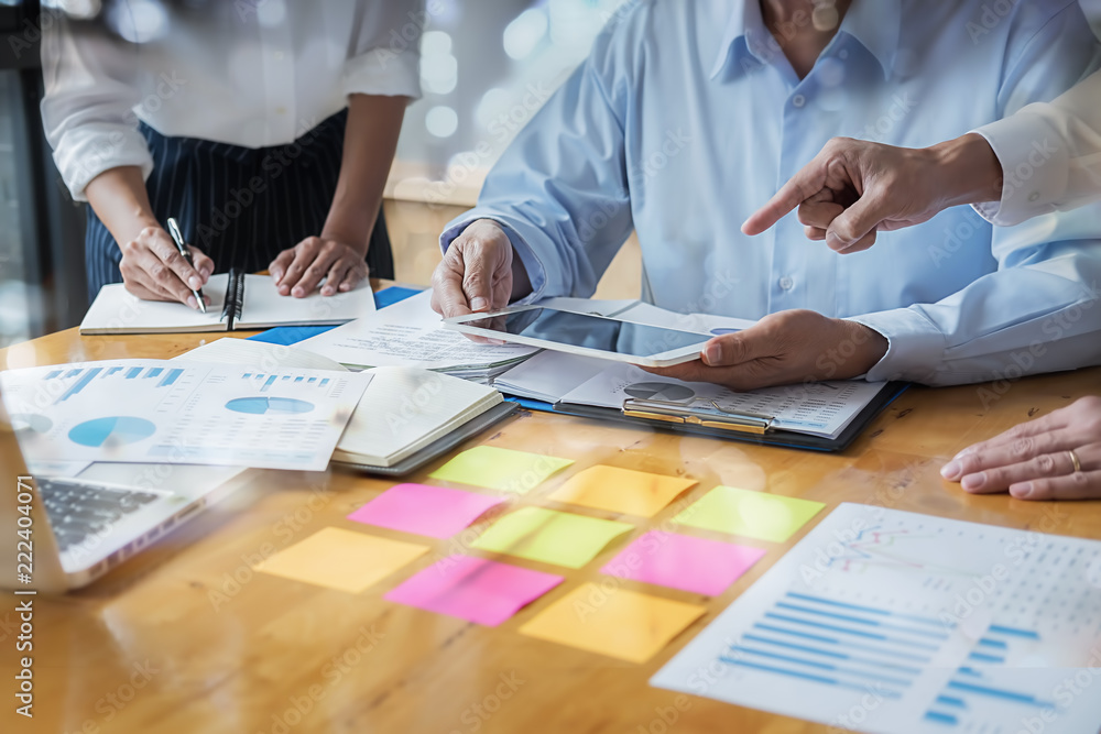 Business adviser analyzing financial figures denoting the progress Internal Revenue Service checking document. Audit concept Business adviser analyzing financial figures denoting the progress Internal Revenue Service checking document. Audit concept