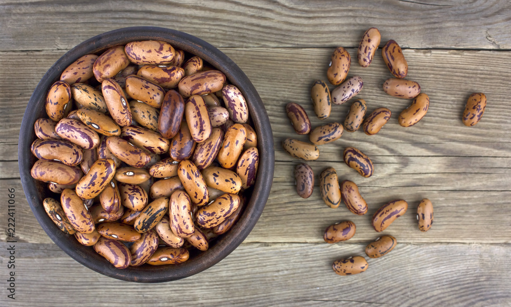 Haricot beans in bowl on wooden background Haricot beans in bowl on wooden background
