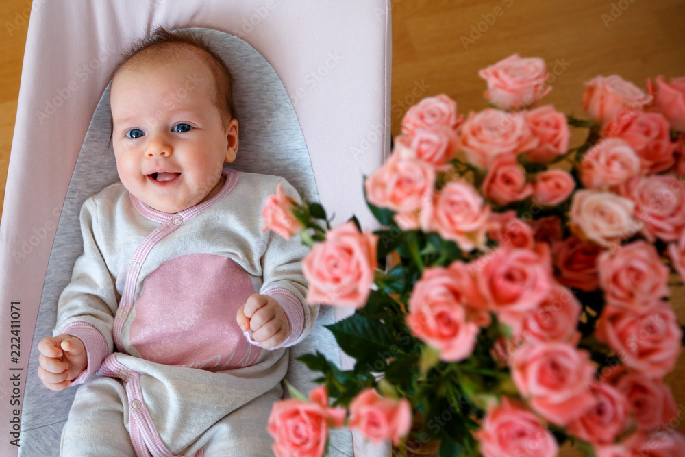 Baby girl having fun in bouncer. Activities for infants