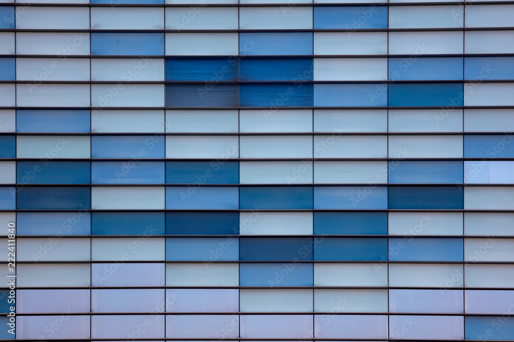 Glass building walls in the rays of sunset as background Glass building walls in the rays of sunset as background