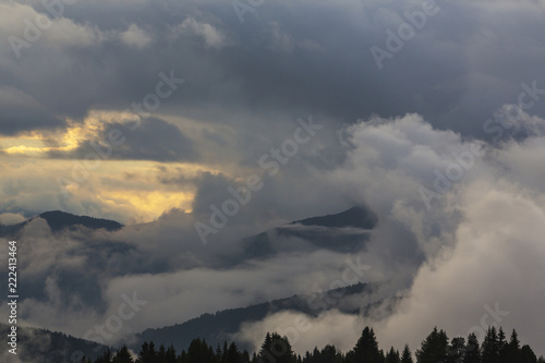 Dramatic clouds at sunset and beautiful light in the Dolomite Alps © Calin Tatu