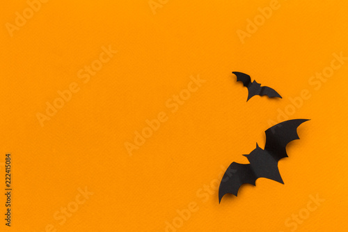 halloween and decoration concept - paper bats flying