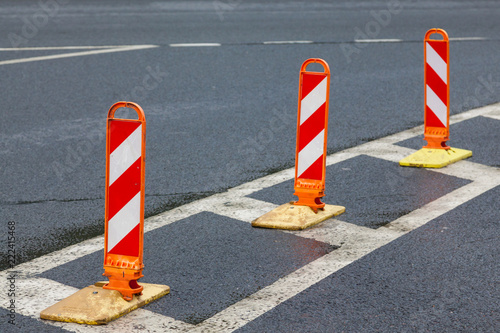 Traffic poles on asphalt road with white marking © Aleksey Sidorov