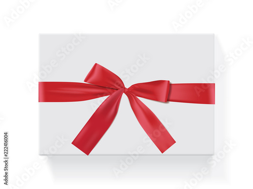 rectangular white box with a red bow  © Ellengold