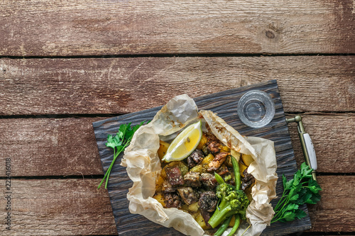 Kleftiko slowly cooked lamb with vegetables and feta cheese. Traditional Greek dish. Copy space photo