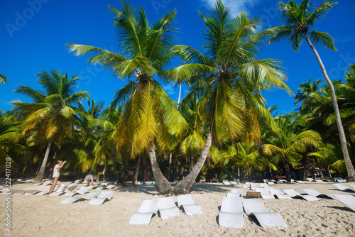 beach with sun loungers on Saona Island © iprachenko