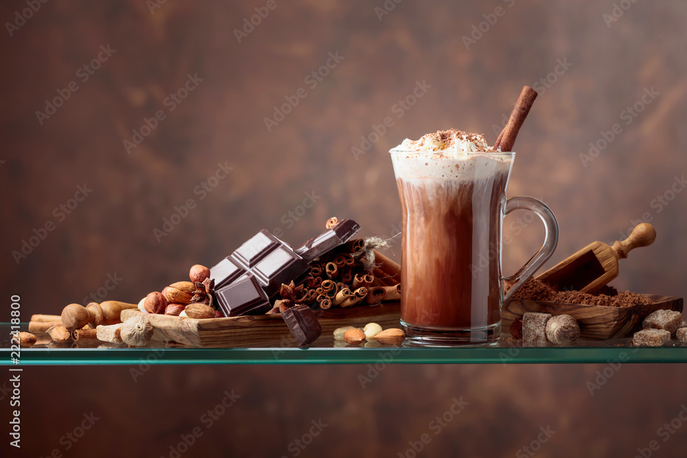 Cocoa with cream, cinnamon, chocolate pieces and various spices. - obrazy, fototapety, plakaty 