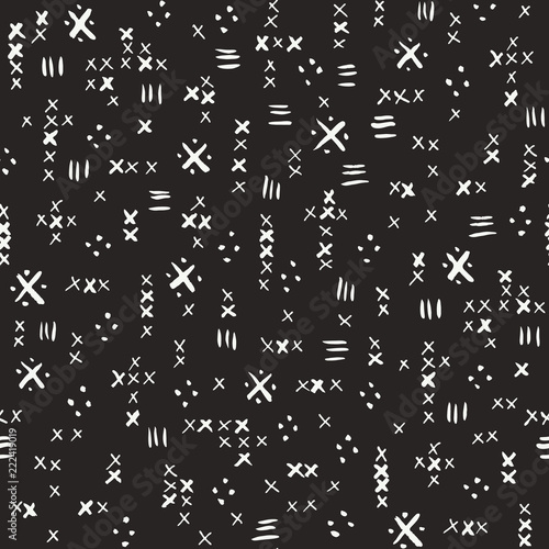 Hand drawn white tribal marks, cross stitches on dark background vector seamless pattern. Abstract geometric print