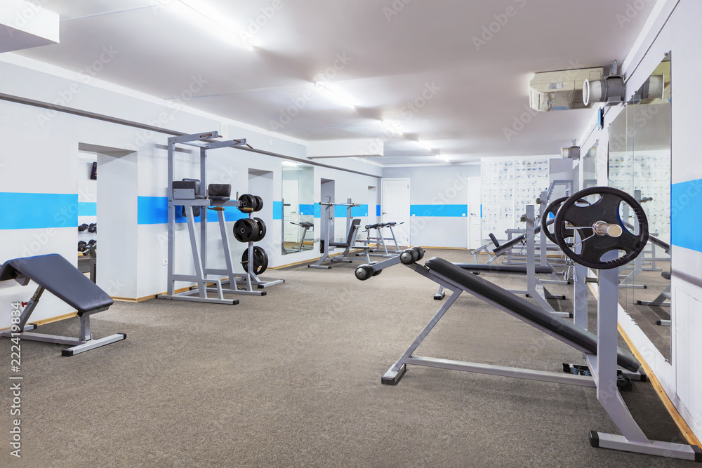 Gym interior with sports equipment.