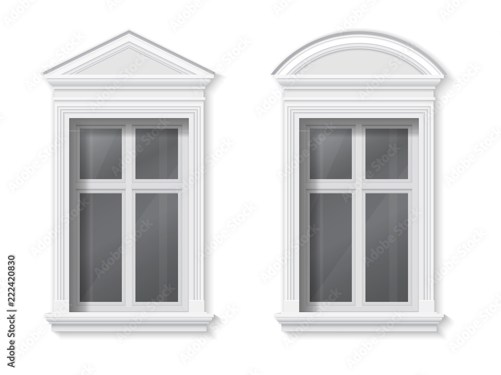 A window in a classic frame with a pediment and trim. Element of architectural decoration of the facade of the building.