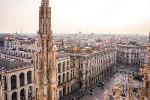 Rooftop view of spires, sculpture, cathederal, and Milan from the Duomo di Milan