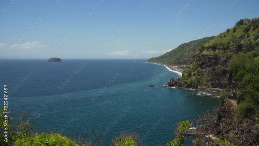 Rocky coast with high cliffs, sea coast, ocean, mountains, sea, beach, sky, clouds. Bali, sea surf with breaking waves on the coast, Indonesia. Ocean with waves and rocky cliff. 4K video. Rocky coast with high cliffs, sea coast, ocean, mountains, sea, beach, sky, clouds. Bali, sea surf with breaking waves on the coast, Indonesia. Ocean with waves and rocky cliff. 4K video.