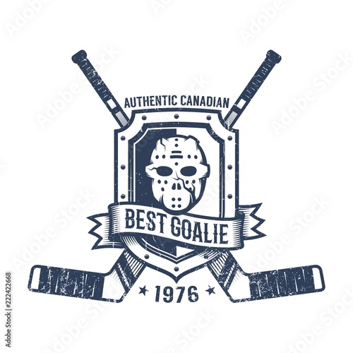 Hockey goalkeeper retro logo - goalie mask, heraldic shield and crossed sticks. Grunge worn texture on a separate layer.