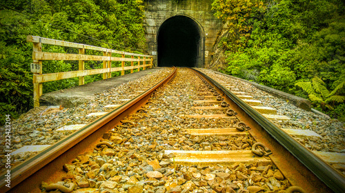 abonded railroad track in new zealand tunnel perpespective