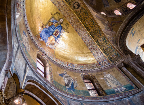 Mosaic of Christ in apse bowl-vault ceiling inside St. Mark`s Basilica, Venice. Italy. 