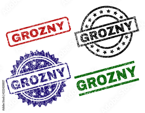 GROZNY seal stamps with distress surface. Black, green,red,blue vector rubber prints of GROZNY caption with dirty surface. Rubber seals with round, rectangle, rosette shapes.